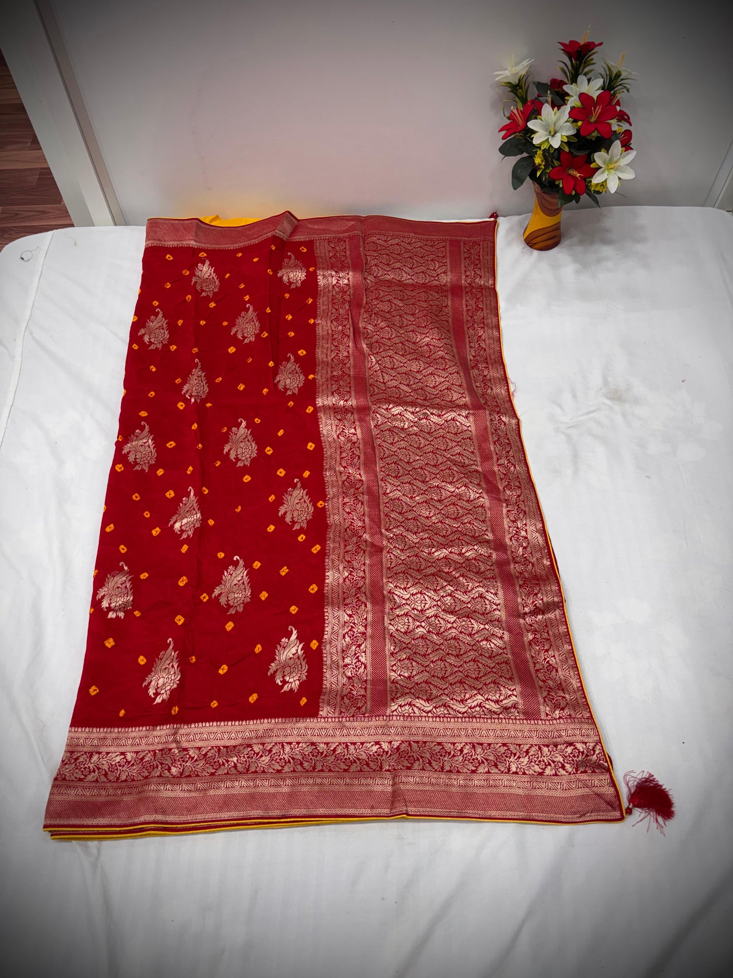Troika Fashion – Deep Red Dola Silk Bandhej Saree with Zari Weaving & Buta Embroidery