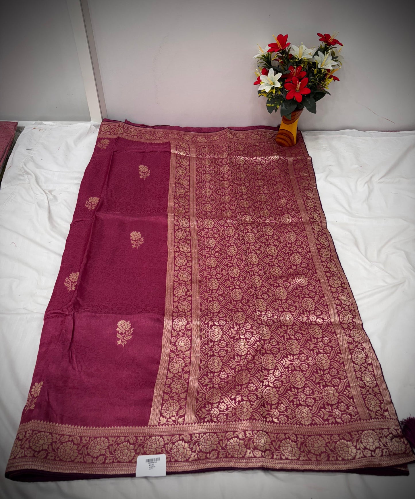 Troika Fashion – Maroon Dola Silk Saree with Golden Zari Floral Weaving & Classic Borders