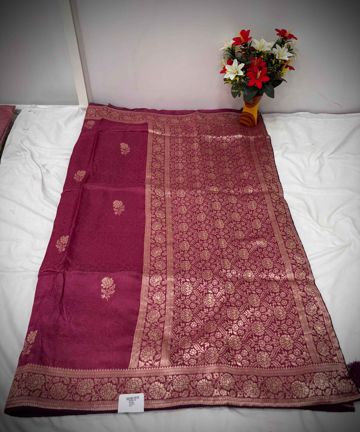 Troika Fashion – Maroon Dola Silk Saree with Golden Zari Floral Weaving & Classic Borders