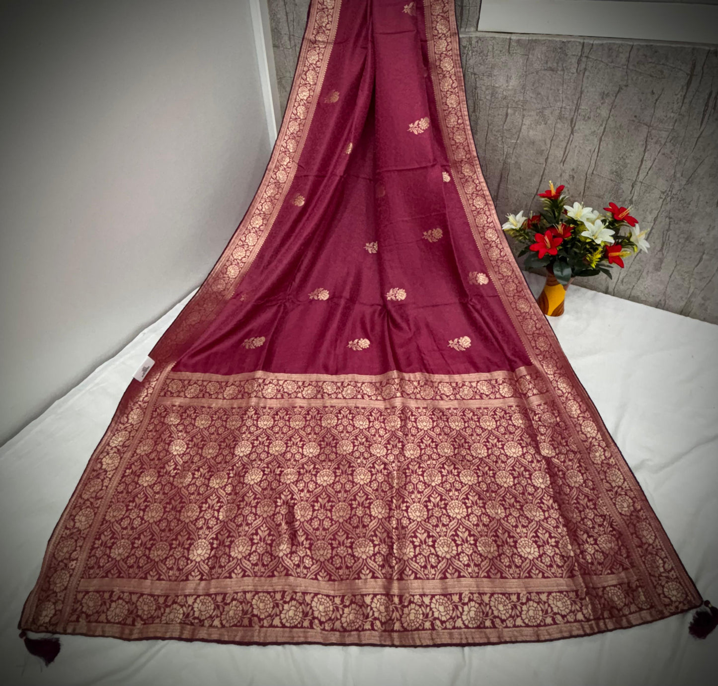 Troika Fashion – Maroon Dola Silk Saree with Golden Zari Floral Weaving & Classic Borders