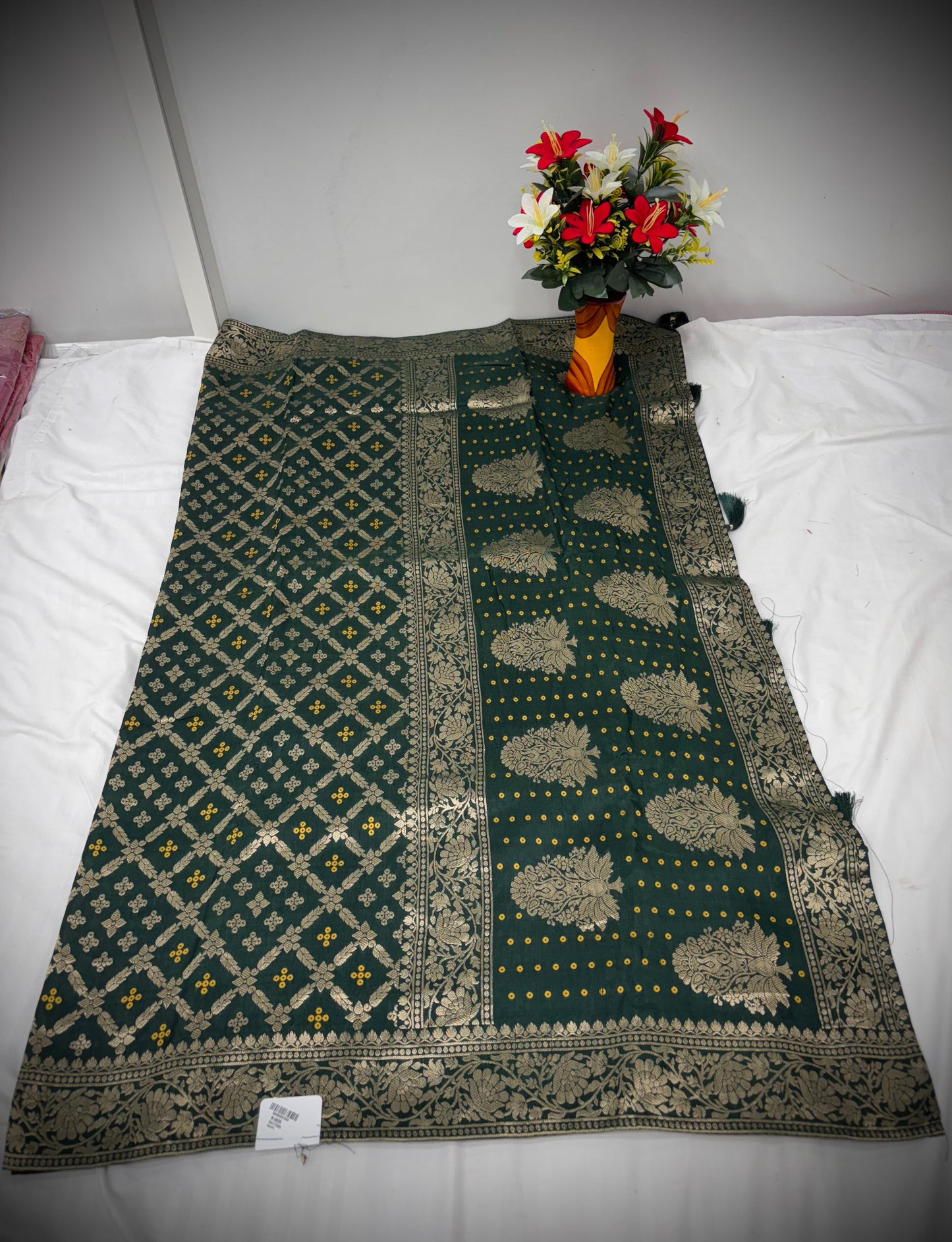 Troika Fashion – Dark Green Dola Silk Saree with Golden Mina Work & Elegant Woven Patterns