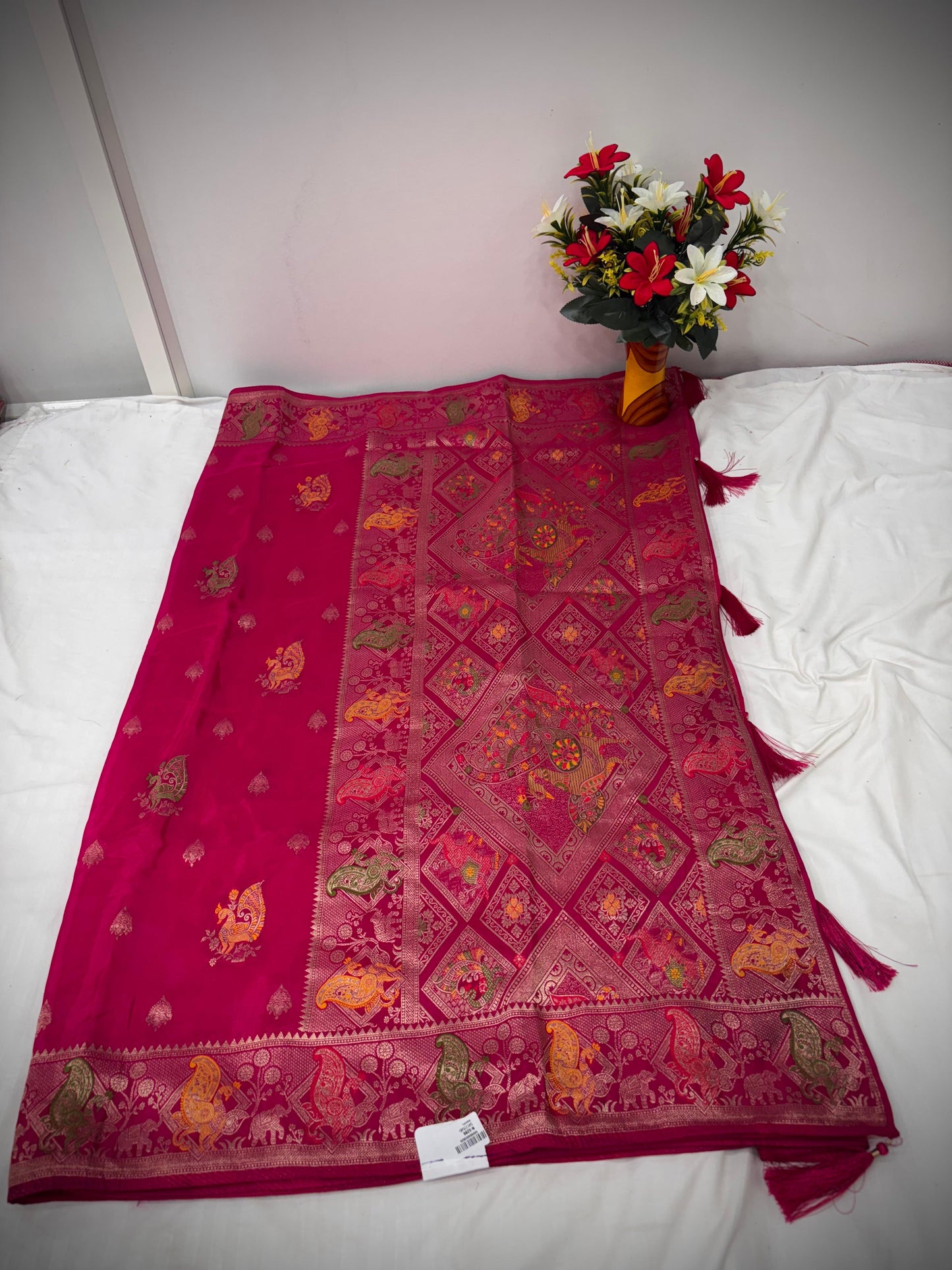 Troika Fashion – Rani Pink HO Silk Saree with Multicolor Zari Weaving & Royal Motifs
